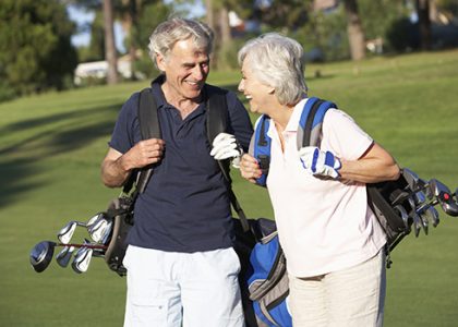 Senior-Couple-Playing-Golf
